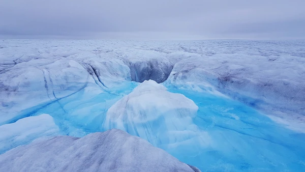 Water flowing into a crevasse (moulin) and down to the bed of Store Glacier. Credit: Poul Christoffersen