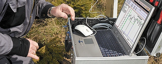  Geologist with measurement instruments 