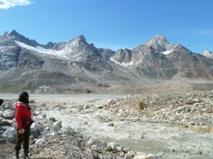 Photo Geologist taking water samples during the MRAPSEG-2010 regional geochemical sampling, at the northern part of the island Ammssalik