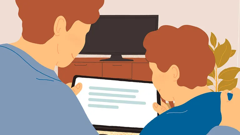 En voksen og et barn kigger på en tablet.